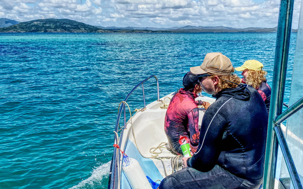 Teenagers on a boat travelling to the reef