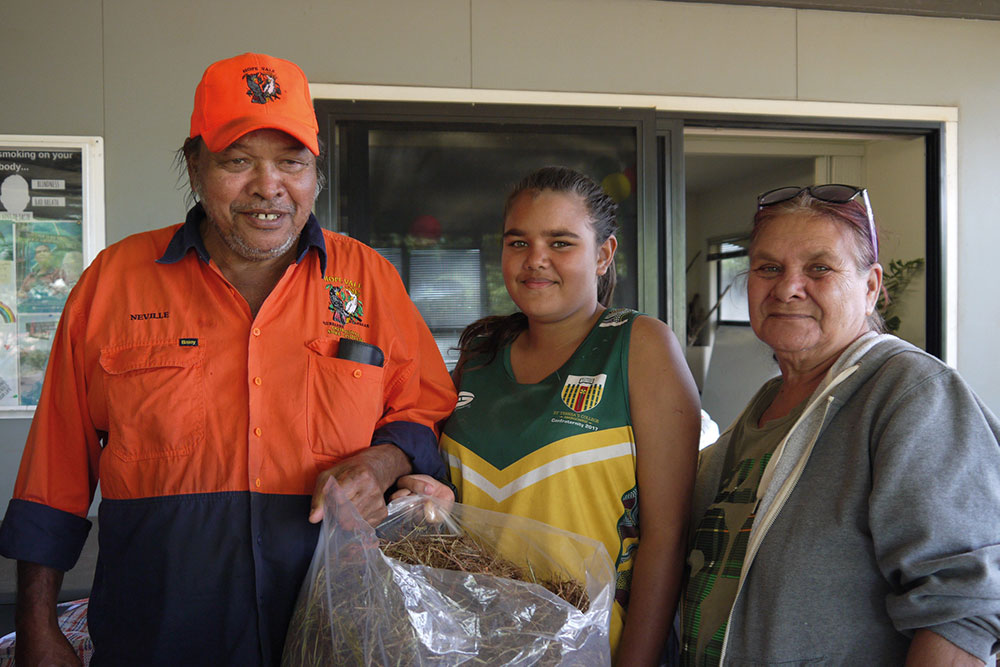 Hope Vale family seed collectors bring their seeds in for weighing