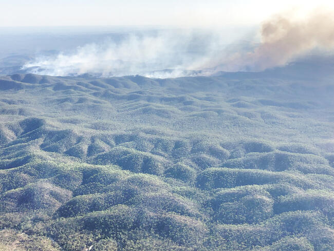 mountains with fire in the distance